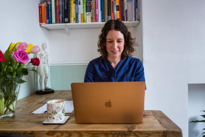 Free Consultation Valerie Salt acupuncturist in Bristol working on computer